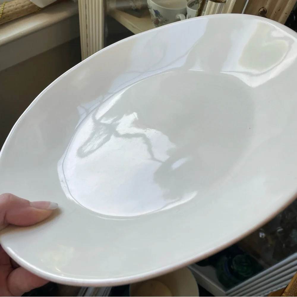 Crate & Barrel white organic wavy dinner plate